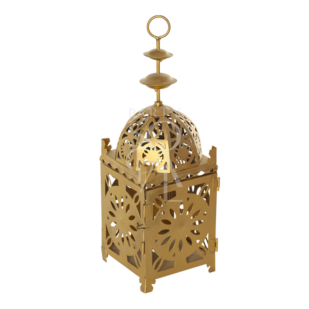 An intricately designed vintage Arabic lantern with a rich gold finish. The lantern features ornate geometric patterns and detailed metalwork, creating a warm, ambient glow when lit. Its classic design includes a hinged door for easy access to the candle or light source inside.