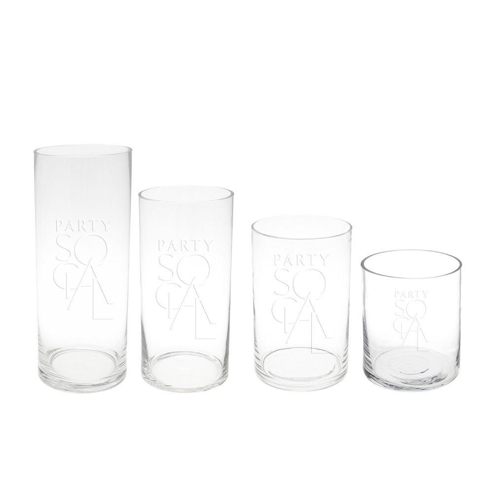 Elegant cylinder glass vases with a simple, clear design, featuring a smooth, cylindrical shape. These vases are ideal for displaying flowers or decorative accents, adding a touch of modern sophistication to any setting.