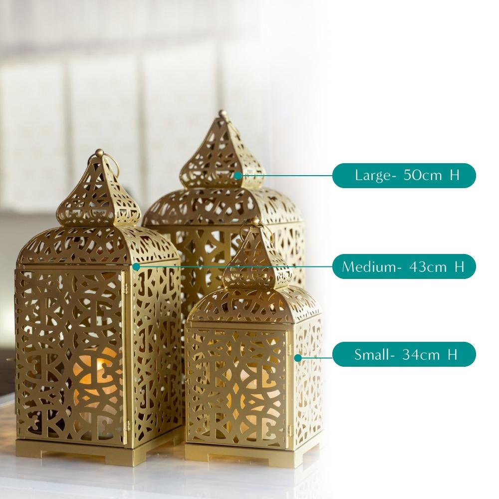 Ornate gold Arabic lanterns featuring intricate geometric patterns and a warm, metallic finish. The lanterns exude a rich, traditional charm, making them ideal for adding a touch of elegance and cultural sophistication to any decor.