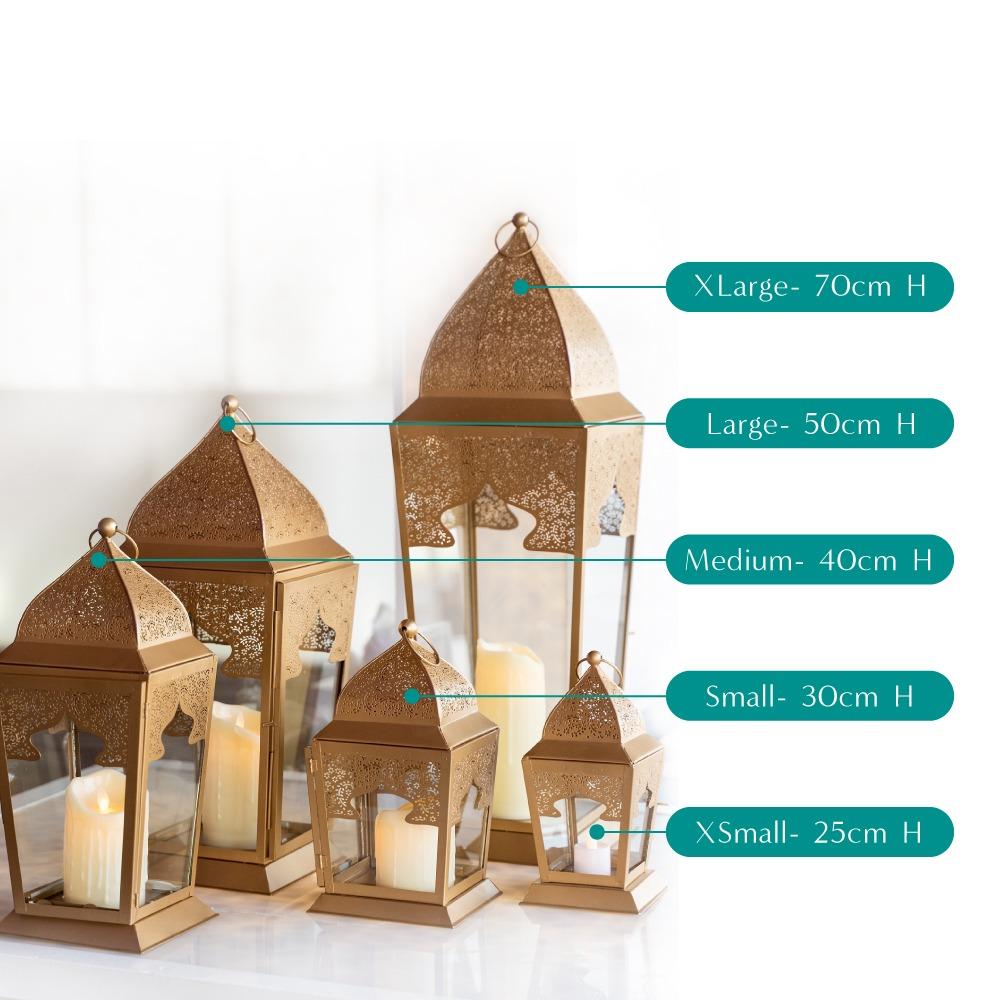 Chic rose gold lanterns with a modern metallic finish, featuring delicate cut-out patterns that cast beautiful light patterns. The lanterns add a touch of warmth and elegance, perfect for enhancing the ambiance of any space with a contemporary flair.