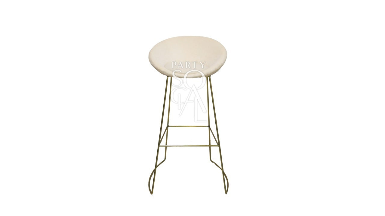 Cream and gold base bar stool featuring a chic and elegant design. The stool is upholstered in soft cream fabric, complemented by a striking gold base that adds a touch of luxury. Its modern design and high-quality materials make it a stylish addition to any bar or counter area, blending sophistication with functionality.