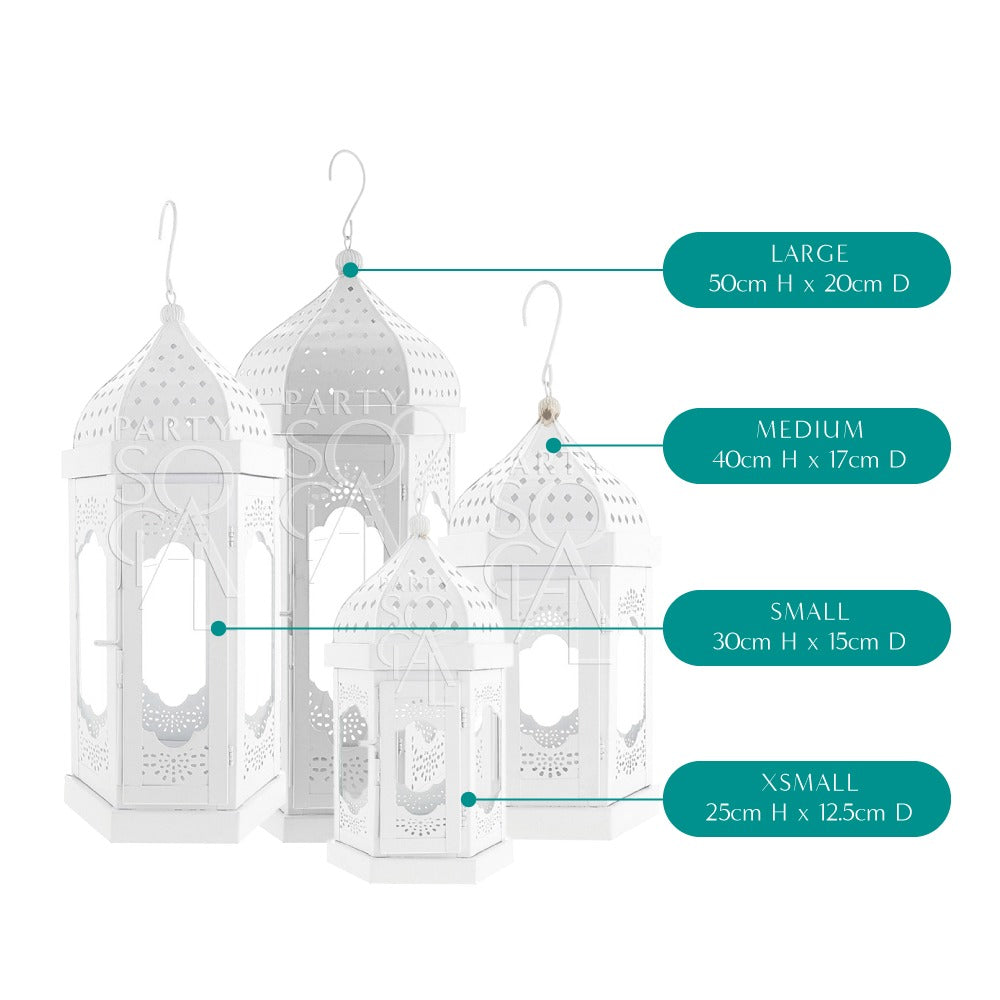 Elegant white Moroccan lanterns with intricate cut-out patterns, featuring a delicate design and soft white finish, adding a touch of exotic charm and sophistication to any space.