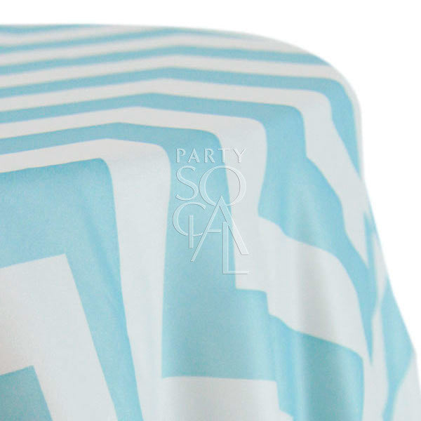 Round tablecloth with a chevron pattern, showcasing a dynamic and stylish design. The chevron pattern adds a modern and geometric touch to the table setting, creating a visually appealing and sophisticated look for any occasion.