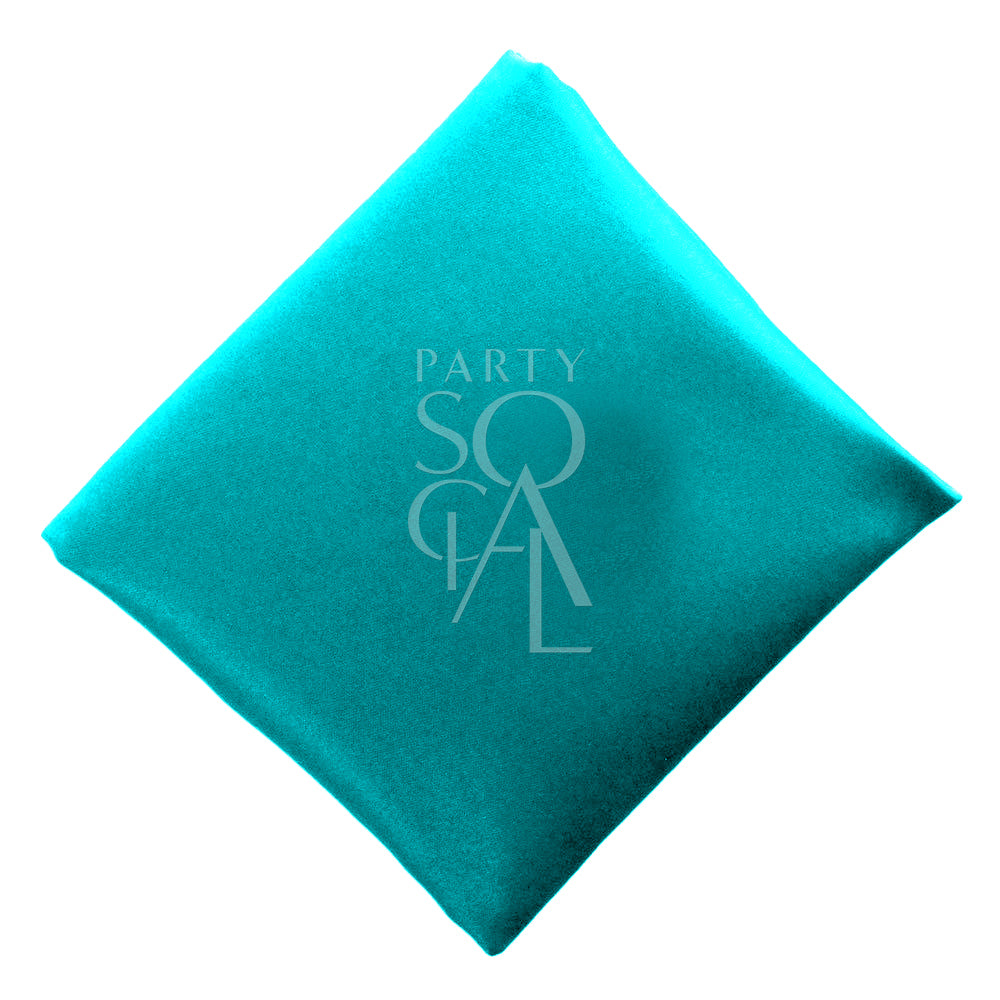 Striking peacock blue satin napkin, offering a bold and vibrant color with a luxurious sheen. The peacock blue adds a modern and elegant touch, perfect for a stylish and contemporary table setting.