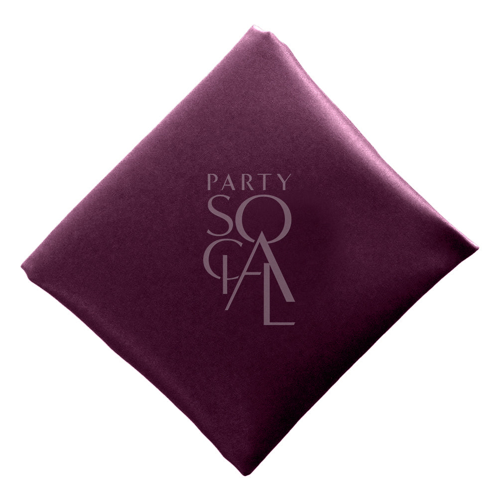 Deep plum satin napkin, showcasing a rich and sophisticated color with a luxurious finish. The plum adds a touch of elegance and refinement, perfect for an upscale table setting.