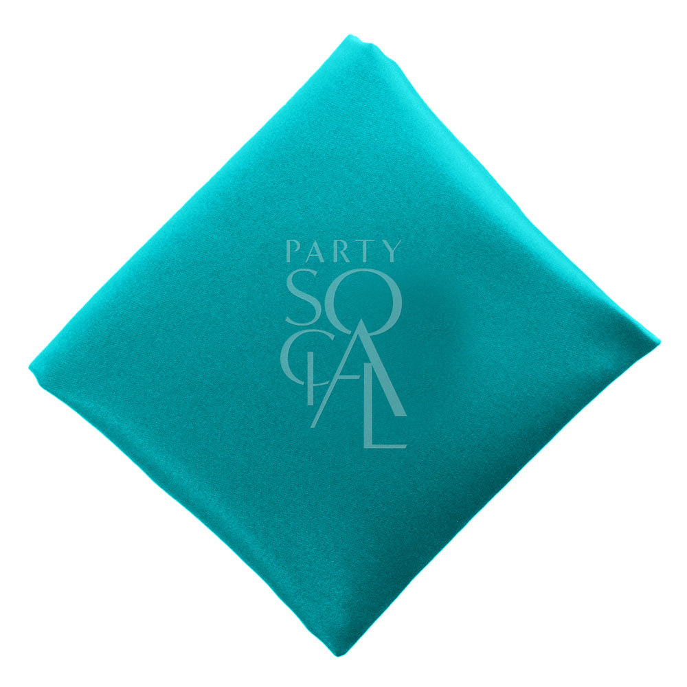 Vibrant turquoise satin napkin, offering a bright and lively color with a luxurious sheen. The turquoise adds a fresh and elegant touch, perfect for a modern and stylish table setting.