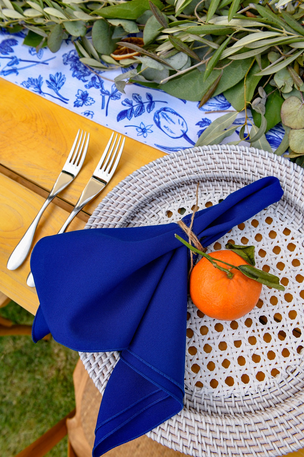 Rattan charger plate with a white wash finish, featuring a distressed and airy look. The white wash rattan adds a rustic yet elegant touch, ideal for a coastal or vintage-inspired table setting.
