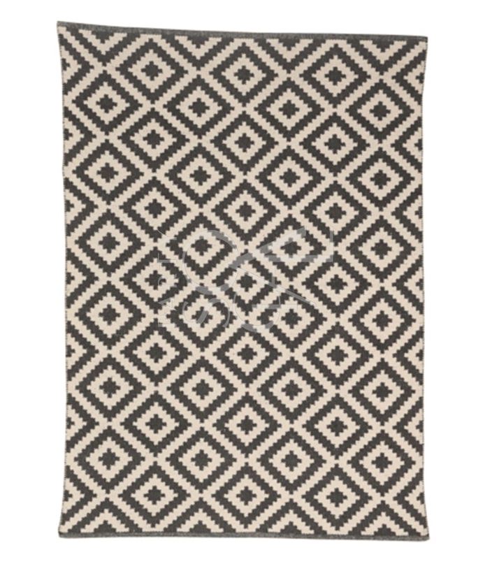 Modern rug featuring a stylish diamond print pattern with a bold geometric design. The rug’s clean lines and contrasting colors create a dynamic visual effect, adding contemporary flair and sophistication to any living space or room decor.
