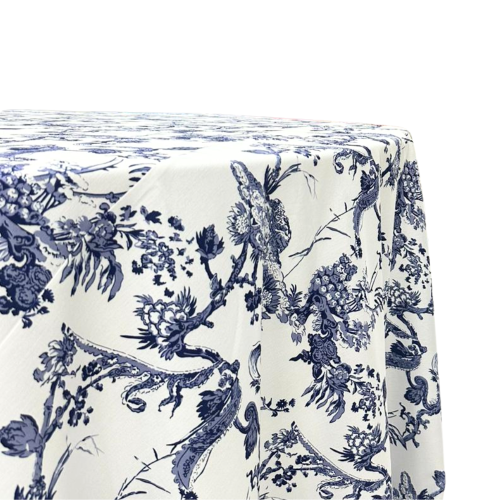 A round tablecloth with a Toile de Jouy print in dark blue, made from a polyester-linen blend fabric. This elegant tablecloth features intricate and classic patterns, adding a touch of sophistication and charm to your dining setting, perfect for both casual and formal occasions.