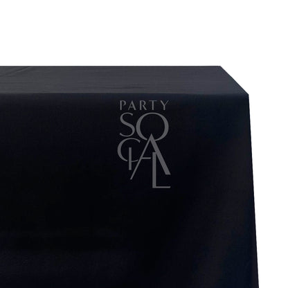 A rectangular cotton-linen tablecloth in classic black, featuring a sleek and versatile design. This elegant tablecloth adds a touch of modern sophistication and refinement to any dining setting, perfect for formal events and stylish everyday use.