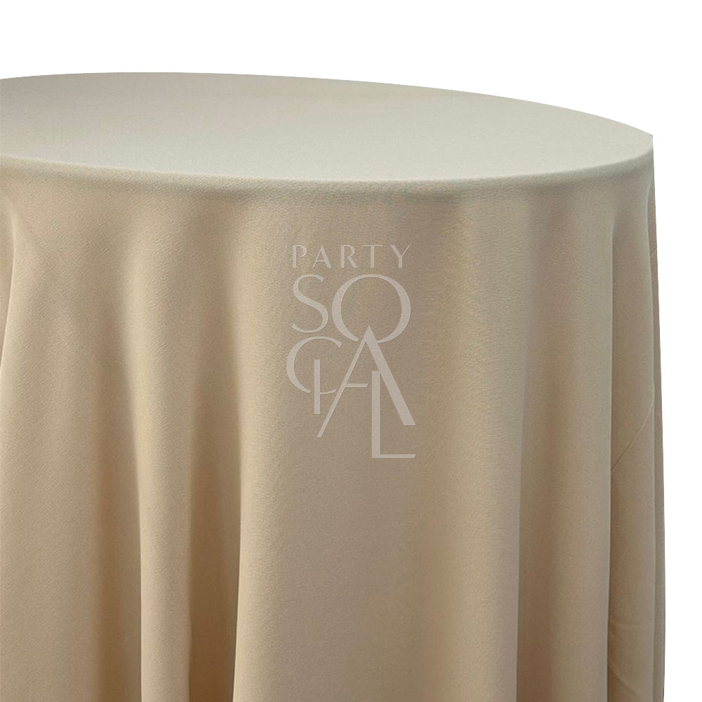 Round cotton linen tablecloth in bleached sand, showcasing a soft and natural tone. The bleached sand color adds an earthy and understated elegance, ideal for a rustic or neutral-themed table.