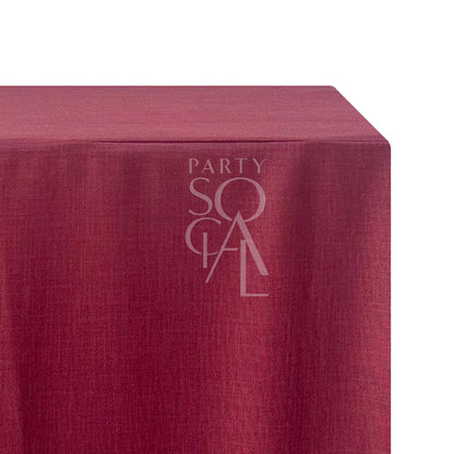 A rectangular linen blend tablecloth in rich burgundy, featuring a deep and luxurious color. This elegant tablecloth enhances your dining setting with a bold and sophisticated touch, ideal for formal dinners and special events.