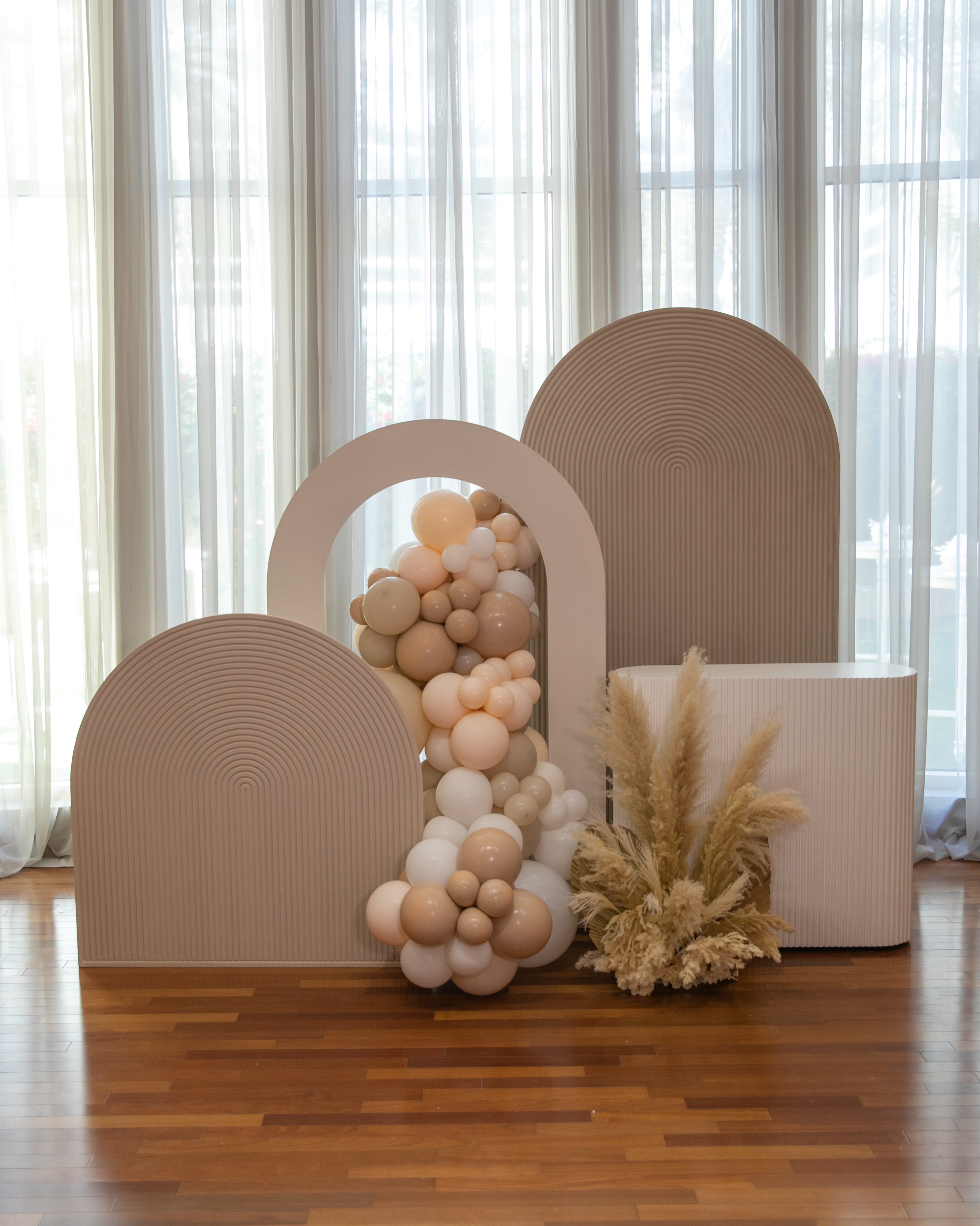 A mini sand-colored molded backdrop, featuring a textured and elegant design. The sand color adds a subtle and sophisticated touch, while the molded texture provides visual interest, making it perfect for enhancing the decor of small events, photo shoots, and special occasions.