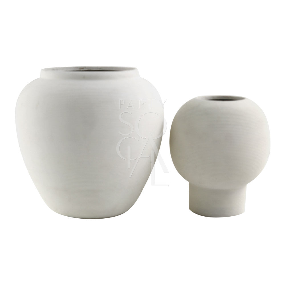 A round, off white lined pot made of ceramic, featuring a sleek and modern design. The off white color and lined texture add a touch of elegance and sophistication, making it a stylish addition to any decor, perfect for holding plants or decorative items.