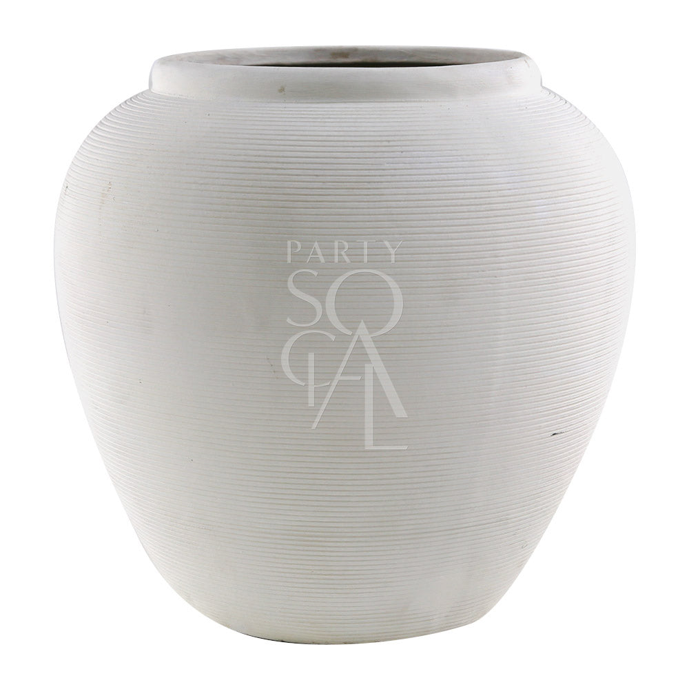 A round, off white lined pot made of ceramic, featuring a sleek and modern design. The off white color and lined texture add a touch of elegance and sophistication, making it a stylish addition to any decor, perfect for holding plants or decorative items.