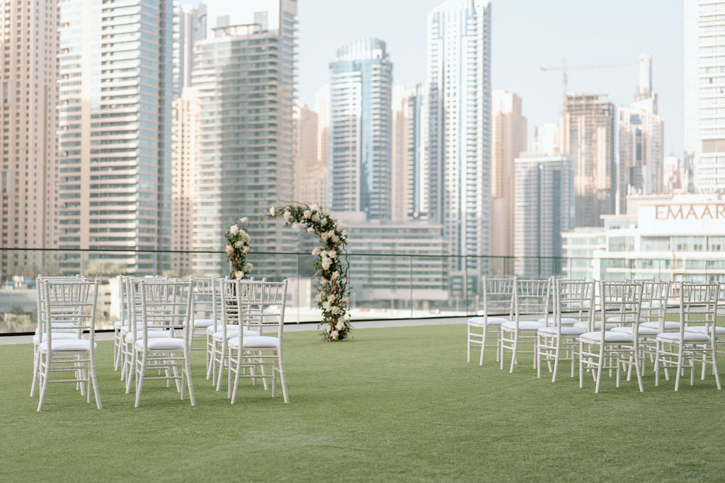 White Chiavari chair with elegant, classic design featuring a high back with vertical slats and a sturdy, lightweight frame. Ideal for formal events and weddings.