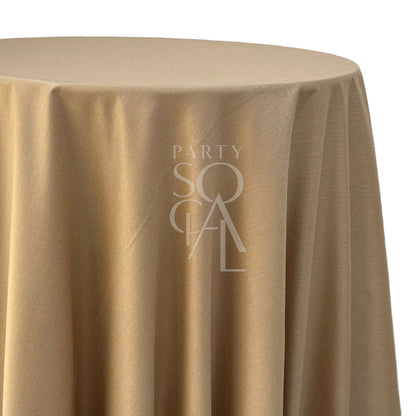 Round linen blend tablecloth in gold, showcasing a luxurious and warm tone. The gold color adds a touch of opulence and sophistication, perfect for creating a glamorous and elegant ambiance.