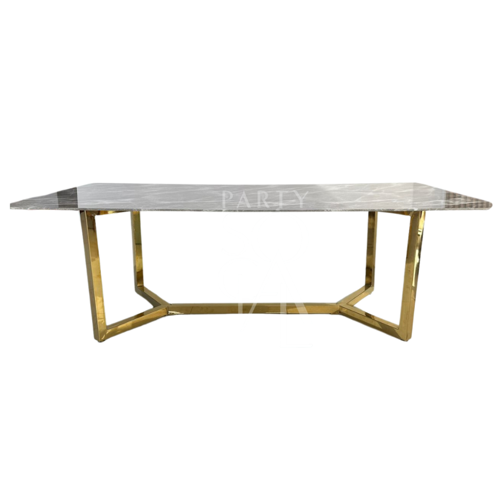 A table with a gold base and a grey marble top, featuring a luxurious and modern design. The gold base provides a striking contrast to the sophisticated grey marble top, creating an elegant and stylish centerpiece. This table enhances any decor with its refined and opulent look.