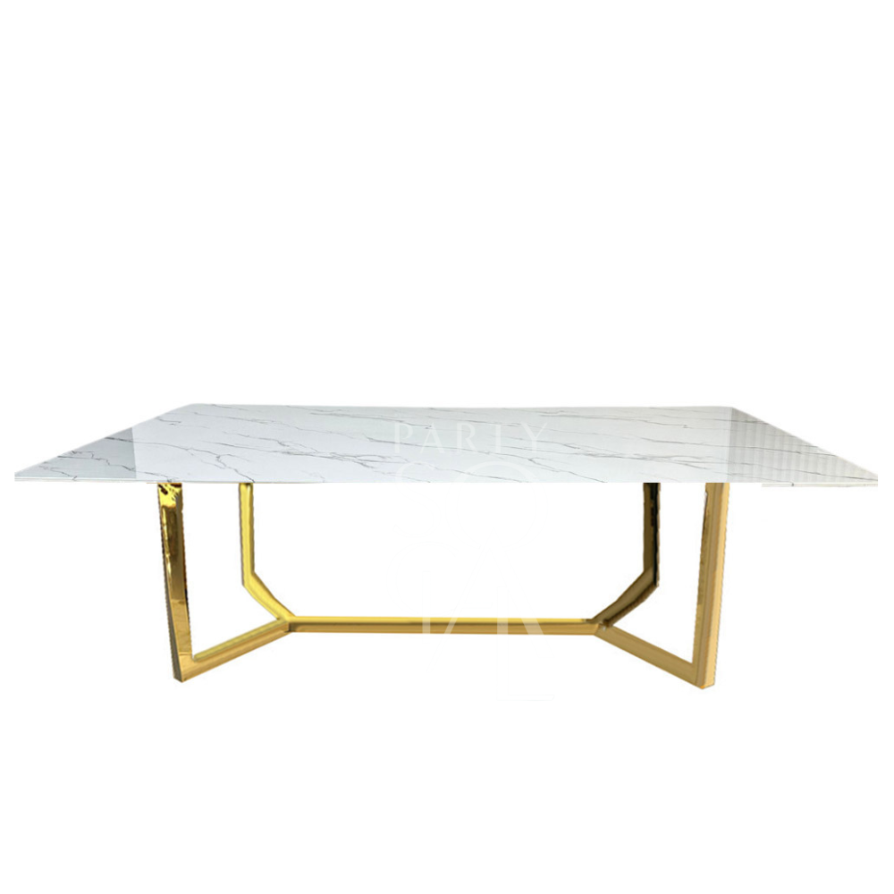 A table with a gold base and a white marble top, featuring a luxurious and elegant design. The gold base adds a touch of opulence, while the white marble top provides a classic and sophisticated finish. This striking combination enhances any decor with its refined and glamorous look.