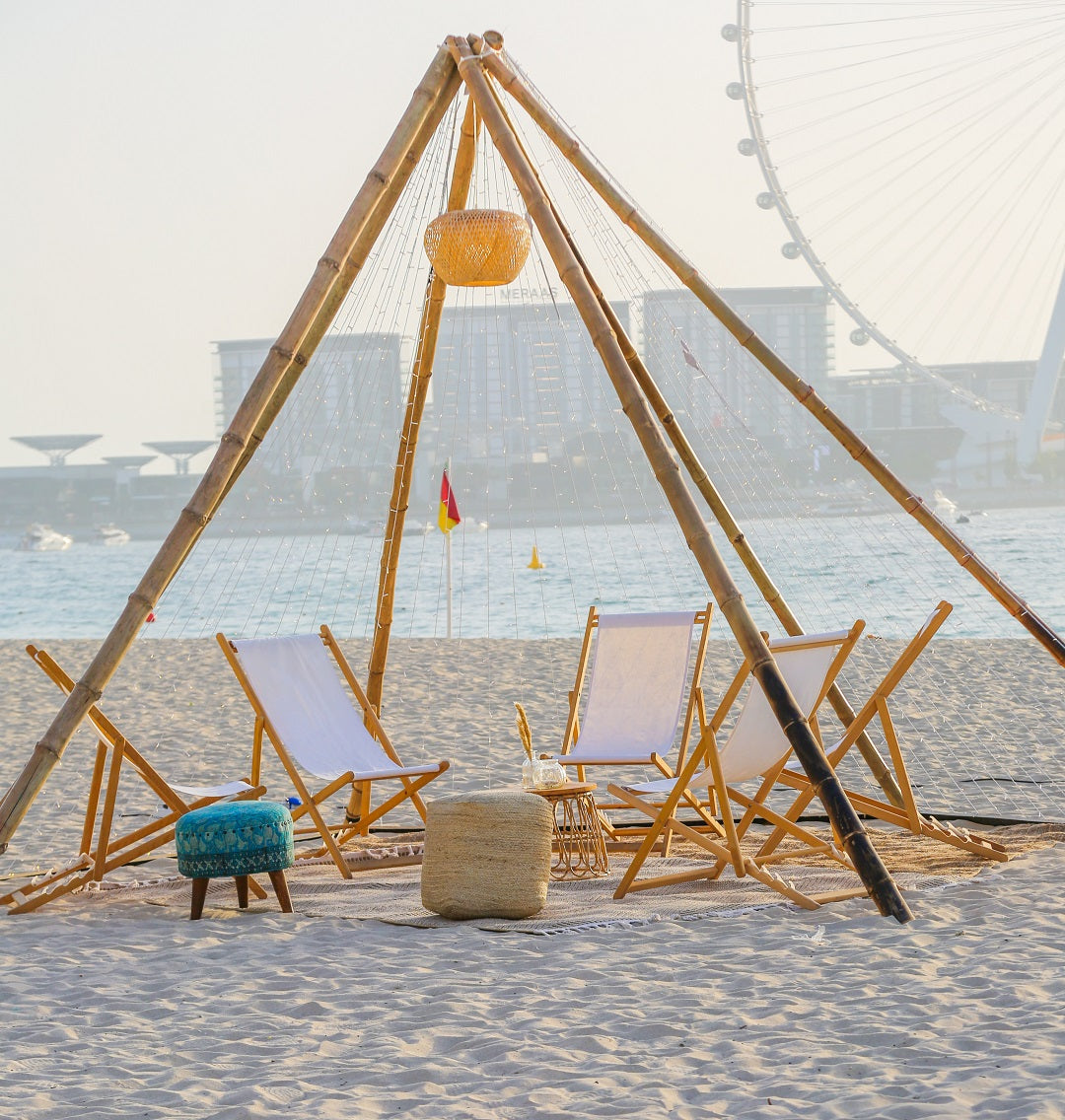 Classic wooden deckchairs with a sturdy frame and natural finish, providing comfortable and stylish outdoor seating, perfect for relaxing on patios, gardens, or beach settings.