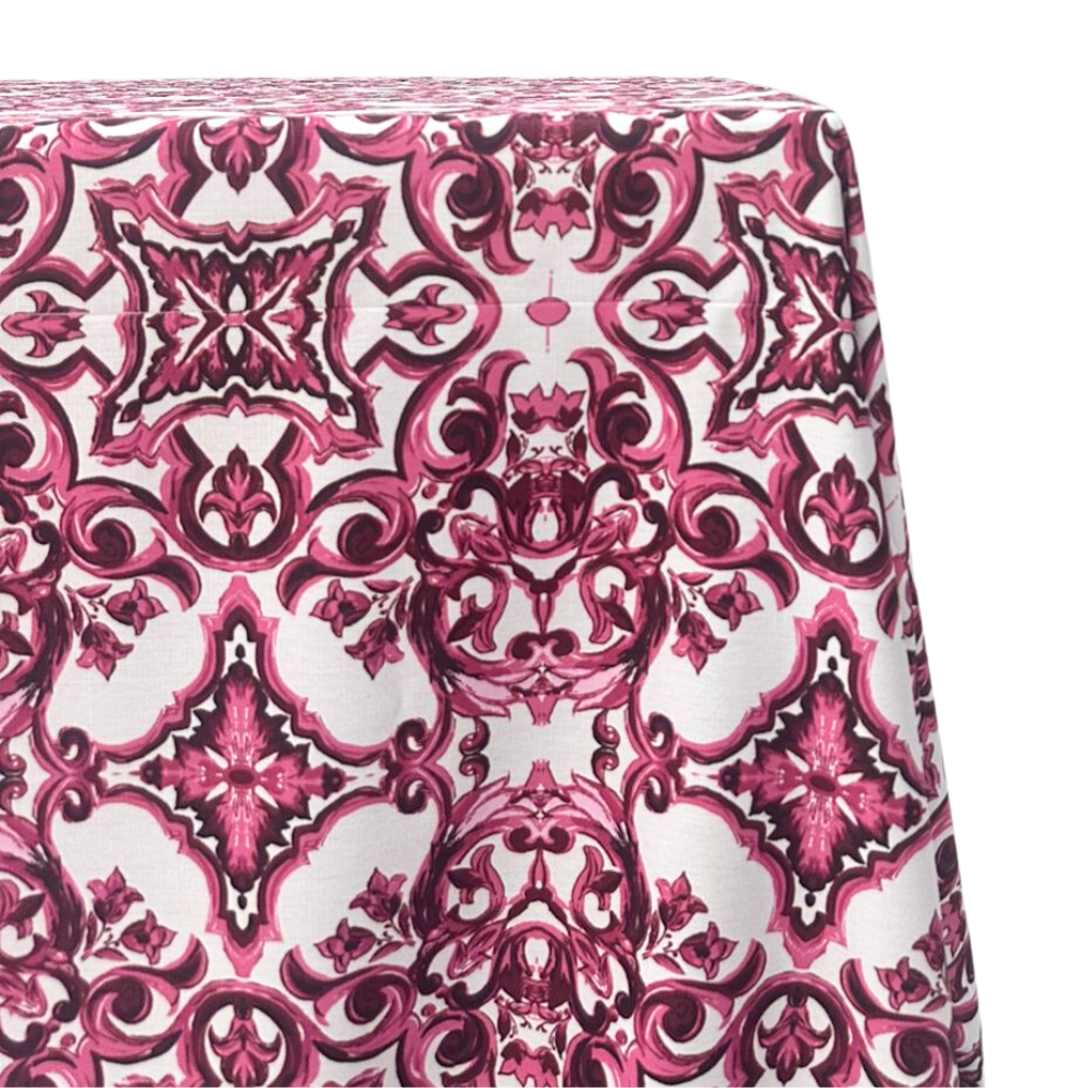 Rectangular Majolica tablecloth in a soft pink hue, featuring intricate patterns inspired by traditional Majolica designs. Ideal for adding a touch of elegance to any dining setup.