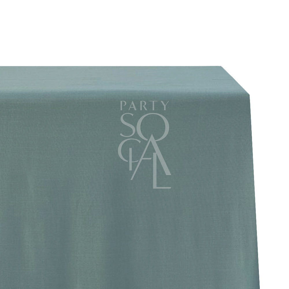 A rectangular cotton-linen tablecloth in refreshing mint green, with a light and soothing hue. This charming tablecloth adds a touch of elegance and a pop of color to your dining area, ideal for both casual and special occasions.