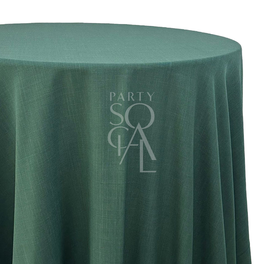 Round cotton linen tablecloth in sage, showcasing a soft and soothing green tone. The sage color adds a calm and natural touch, ideal for creating a serene and elegant table setting.