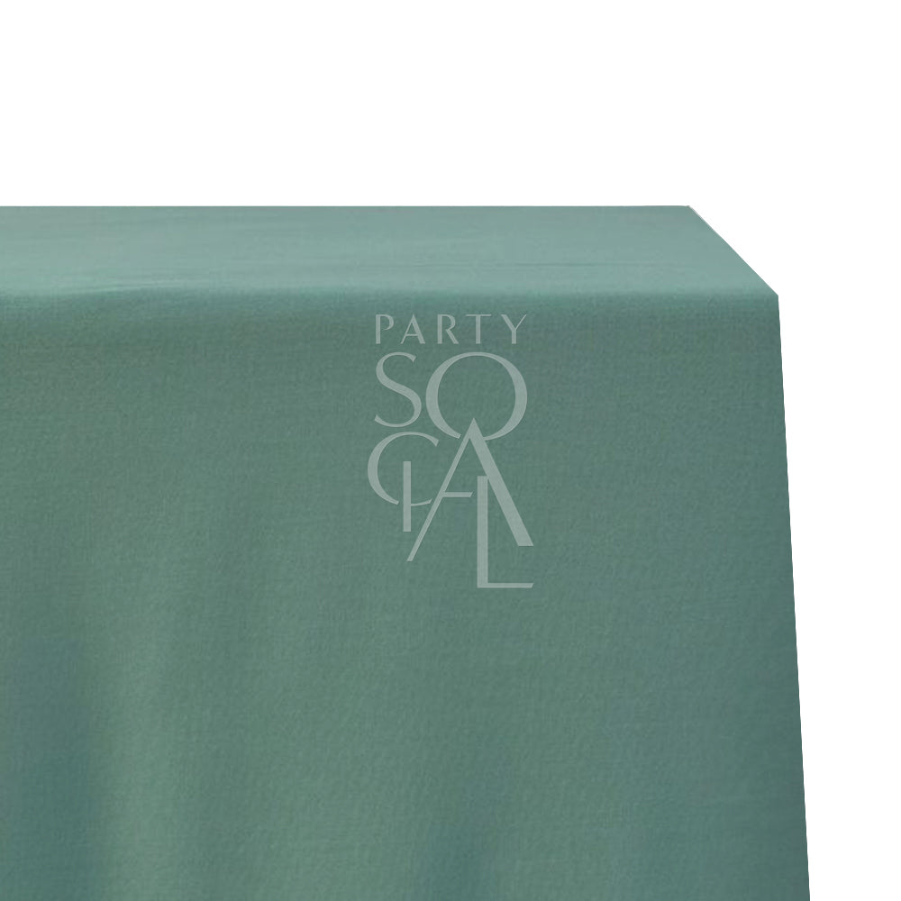 A rectangular cotton-linen tablecloth in gentle sage, featuring a calming and natural tone. This sophisticated tablecloth adds a touch of understated elegance and tranquility to your dining setting, perfect for both formal and casual events.