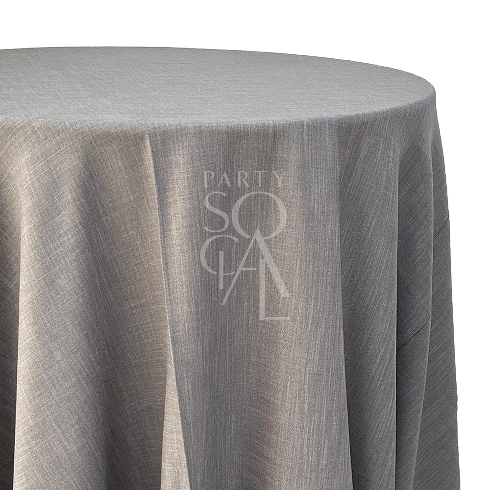 Round linen blend tablecloth in taupe, featuring a soft and neutral tone. The taupe color adds a warm and sophisticated touch, perfect for creating a serene and elegant table setting.