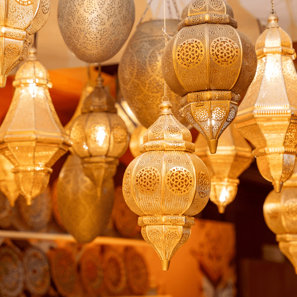 A cone-shaped Moroccan hanging pendant in rose gold, featuring intricate and detailed metalwork. The rose gold finish adds a touch of luxury and warmth, while the cone shape and elaborate patterns create an exotic and sophisticated ambiance, perfect for enhancing the decor of any room.