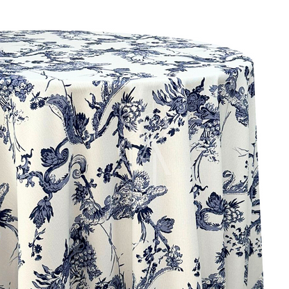 A round tablecloth with a Toile de Jouy print in dark blue, made from a polyester-linen blend fabric. This elegant tablecloth features intricate and classic patterns, adding a touch of sophistication and charm to your dining setting, perfect for both casual and formal occasions.