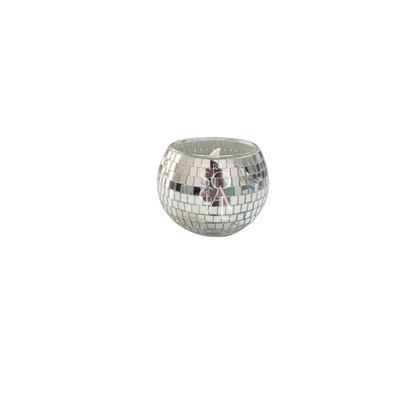 A silver Disco Ball Candle Holder featuring a playful and stylish mirrored design. This unique candle holder adds a touch of retro glamour and sparkle to any table setting or decor. Ideal for parties, events, and themed celebrations, it reflects light beautifully and enhances the atmosphere with its eye-catching and festive appearance.