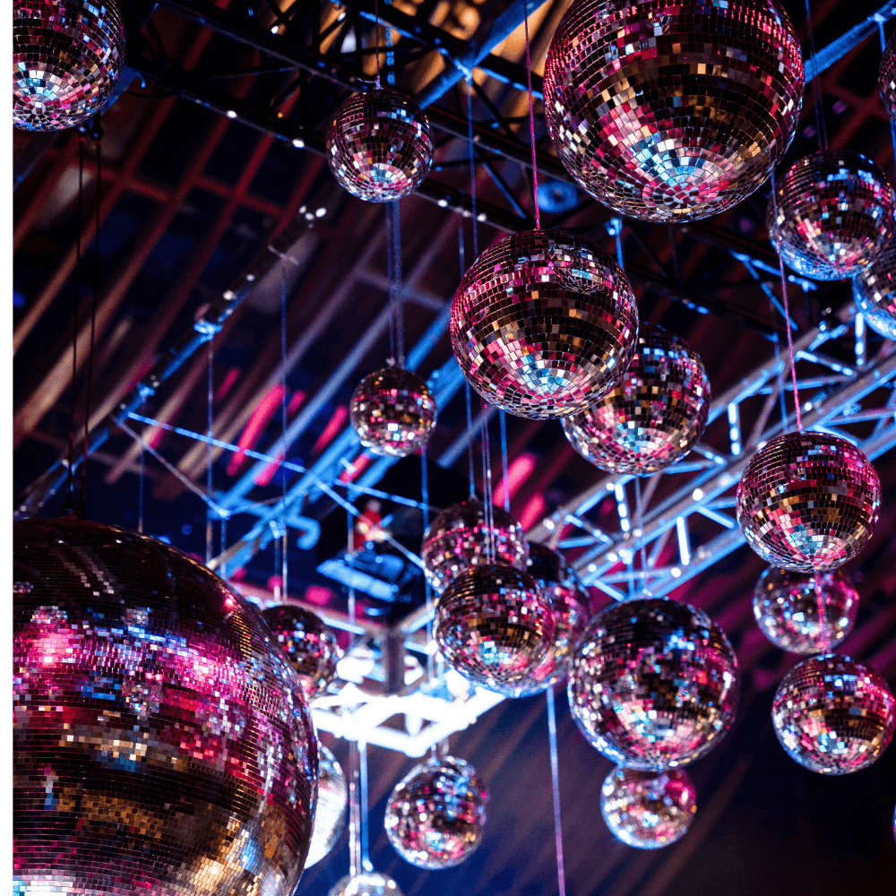 Disco Balls, available for rent, featuring a classic mirrored design that adds a sparkling, retro touch to any event. These eye-catching decorations are perfect for creating a lively and festive atmosphere at parties, weddings, and other celebrations. The shimmering surfaces reflect light beautifully, enhancing your event with a dynamic and glamorous effect. Ideal for dance floors and themed parties, these Disco Balls bring a fun and vibrant element to your decor.