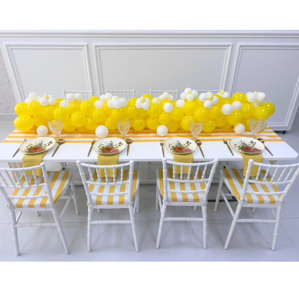 Mini Chiavari chair in white, designed with a classic and elegant look. This chair features a traditional Chiavari silhouette with a white finish, making it a versatile choice for upscale events and gatherings. Its compact size is perfect for adding a touch of sophistication to smaller spaces or for use as a stylish accent in various settings.