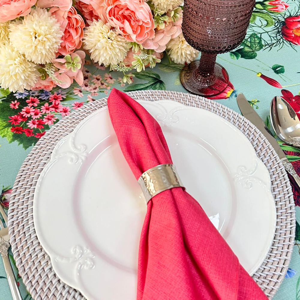 A silver hammered round napkin ring, featuring a textured, hammered finish that adds a touch of elegance and sophistication. This stylish napkin ring enhances any table setting with its refined and modern design, perfect for formal dinners, parties, and special occasions.