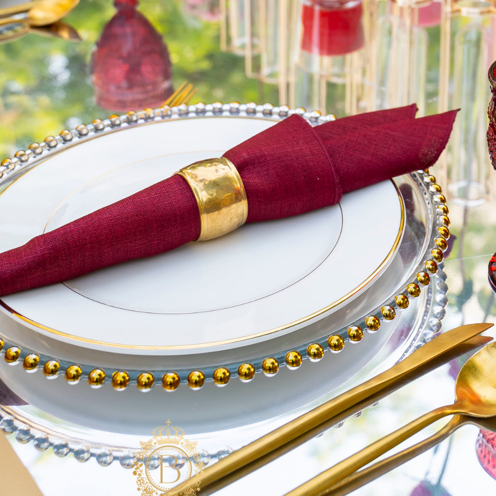 Napkin ring with a hammered dome design, featuring a textured surface for a stylish and contemporary look.