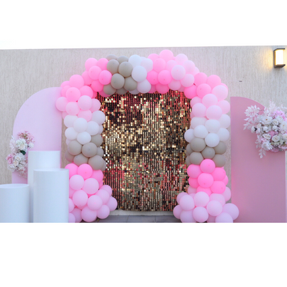 A Pink Chic Balloon Backdrop featuring a stylish arrangement of pink balloons in various shades and sizes. This elegant backdrop, available for rent, is designed to create a sophisticated and eye-catching display for events and parties. Perfect for adding a touch of glamour to celebrations, it provides a vibrant and festive background for photos and decorations. Ideal for birthdays, weddings, and other special occasions, it enhances your event with its chic and playful design.