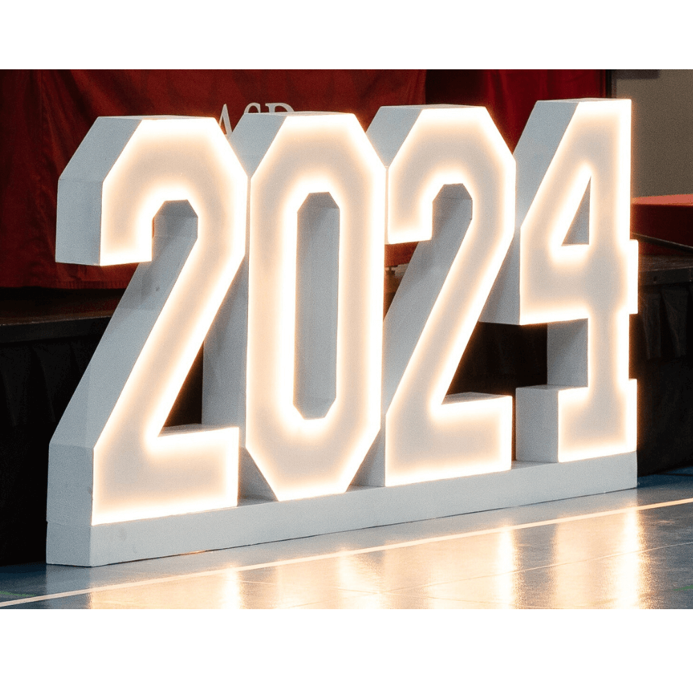 An LED stand displaying &quot;2024&quot; in white and red, featuring a bright and modern design. This eye-catching indoor stand is perfect for celebrating the new year, adding a festive and vibrant touch to events, parties, and home decor.