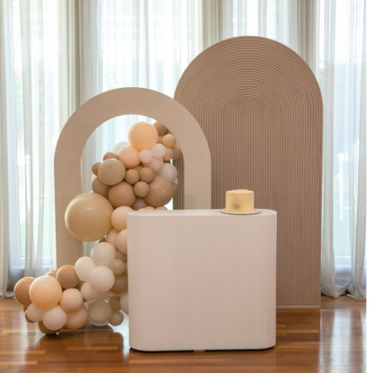 A rippled white counter podium, featuring a sleek and modern design. The rippled texture adds visual interest and elegance, while the clean white color enhances its contemporary appeal. Ideal for events, presentations, and displays, this podium adds a touch of sophistication to any setting.