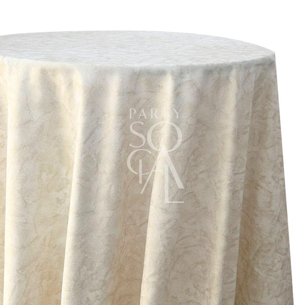 A round linen tablecloth with gold foil accents, featuring a shimmering gold design. This elegant tablecloth adds a touch of luxury and sophistication to your dining setting, perfect for special occasions and formal events with its rich, reflective finish.