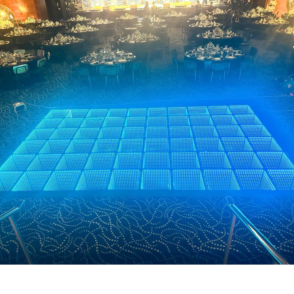 A Dance Floor, available for rent, designed to provide a stylish and sturdy surface for dancing and events. This versatile dance floor enhances any celebration with its sleek and professional appearance, ideal for weddings, parties, and special occasions. Its durable construction ensures a safe and enjoyable experience for guests, while its elegant design complements a variety of event themes and settings. Perfect for creating a dynamic and engaging atmosphere on the dance floor.