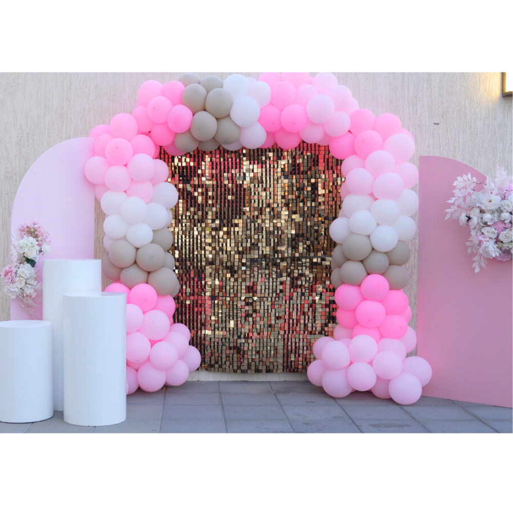 A Pink Chic Balloon Backdrop featuring a stylish arrangement of pink balloons in various shades and sizes. This elegant backdrop, available for rent, is designed to create a sophisticated and eye-catching display for events and parties. Perfect for adding a touch of glamour to celebrations, it provides a vibrant and festive background for photos and decorations. Ideal for birthdays, weddings, and other special occasions, it enhances your event with its chic and playful design.