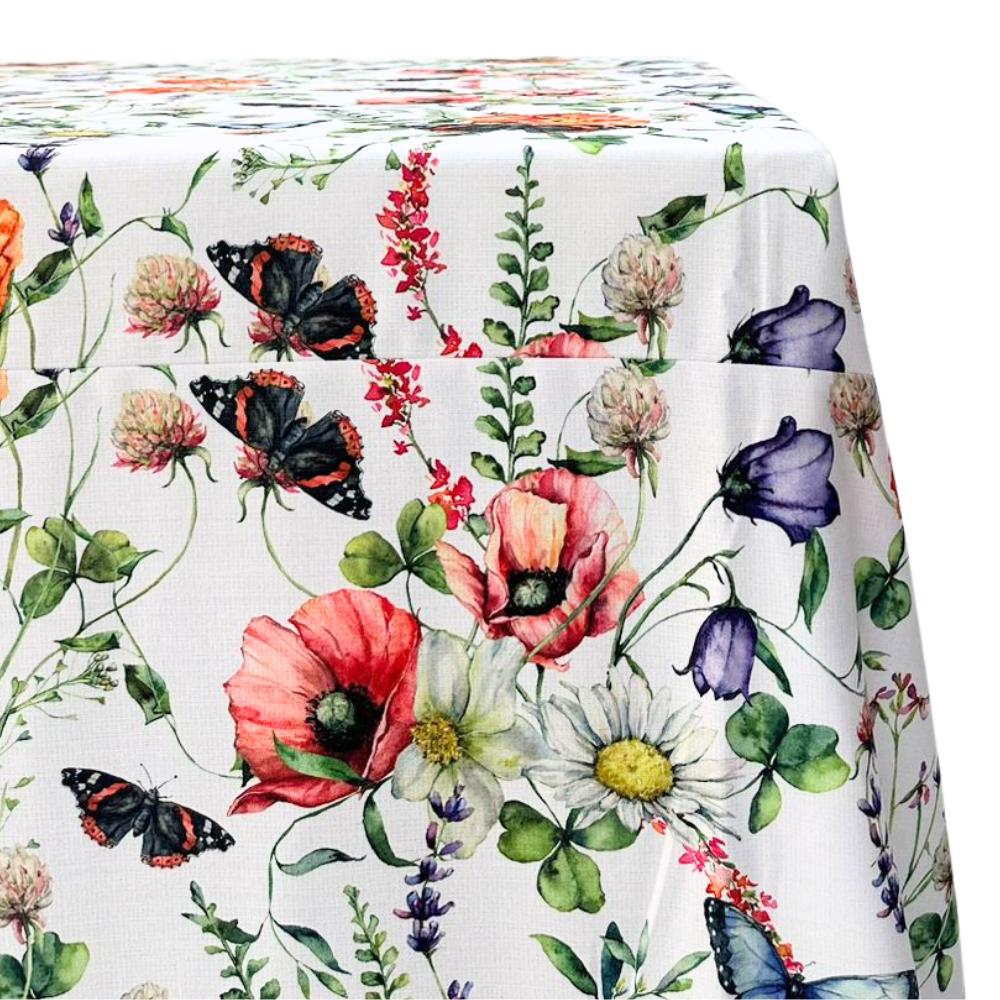 A Butterfly Meadows rectangular tablecloth featuring a whimsical, nature-inspired design with colorful butterflies and floral elements. This high-quality tablecloth, measuring 360cm L x 280cm W, brings a touch of charm and elegance to your dining area. Made from durable, easy-to-clean fabric, it’s perfect for adding a vibrant and playful touch to both casual meals and special events. Available in this generous size, it enhances your dining experience with its unique and eye-catching design.