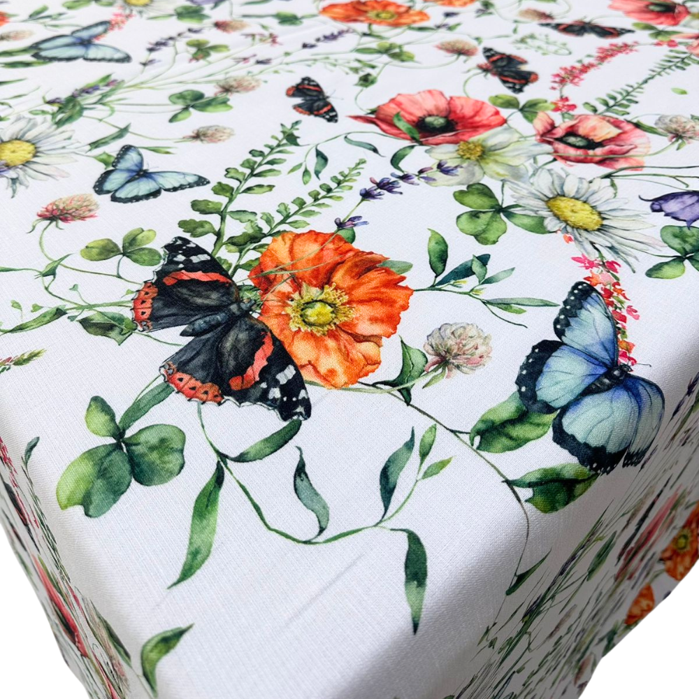 A Butterfly Meadows rectangular tablecloth featuring a whimsical, nature-inspired design with colorful butterflies and floral elements. This high-quality tablecloth, measuring 360cm L x 280cm W, brings a touch of charm and elegance to your dining area. Made from durable, easy-to-clean fabric, it’s perfect for adding a vibrant and playful touch to both casual meals and special events. Available in this generous size, it enhances your dining experience with its unique and eye-catching design.