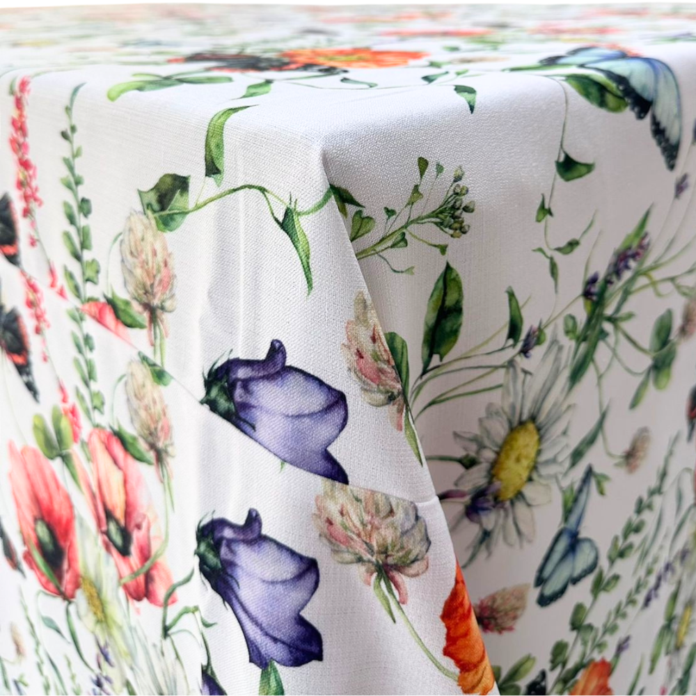 A Butterfly Meadows rectangular tablecloth featuring a whimsical, nature-inspired design with colorful butterflies and floral elements. This high-quality tablecloth, measuring 360cm L x 280cm W, brings a touch of charm and elegance to your dining area. Made from durable, easy-to-clean fabric, it’s perfect for adding a vibrant and playful touch to both casual meals and special events. Available in this generous size, it enhances your dining experience with its unique and eye-catching design.