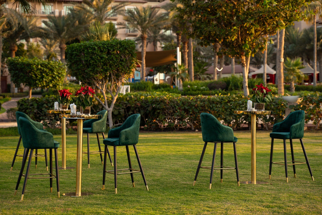 A stylish velvet stool in royal green. This elegant stool features a plush velvet upholstery in a rich, vibrant green color, adding a touch of luxury and sophistication. Ideal for use as extra seating or as a decorative accent, its deep green hue enhances any space with a pop of color and class.