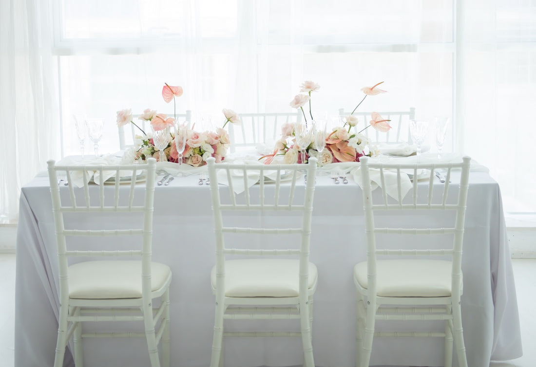 White Chiavari chair with elegant, classic design featuring a high back with vertical slats and a sturdy, lightweight frame. Ideal for formal events and weddings.