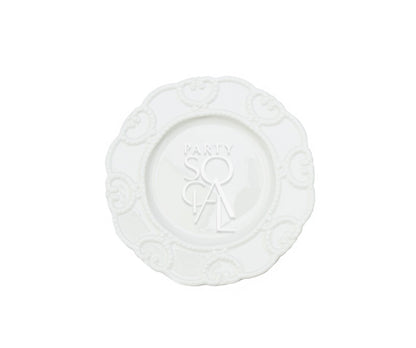 White embossed plates featuring a detailed, textured pattern that adds a touch of elegance to any table setting. The classic white color and intricate embossing make these plates suitable for both formal occasions and everyday dining, offering a sophisticated look with a subtle design element.