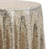 Round sequin tablecloth in light champagne, featuring a soft, warm shimmer. The light champagne sequins offer a subtle and elegant glow, perfect for adding a refined and romantic touch to any table setting.