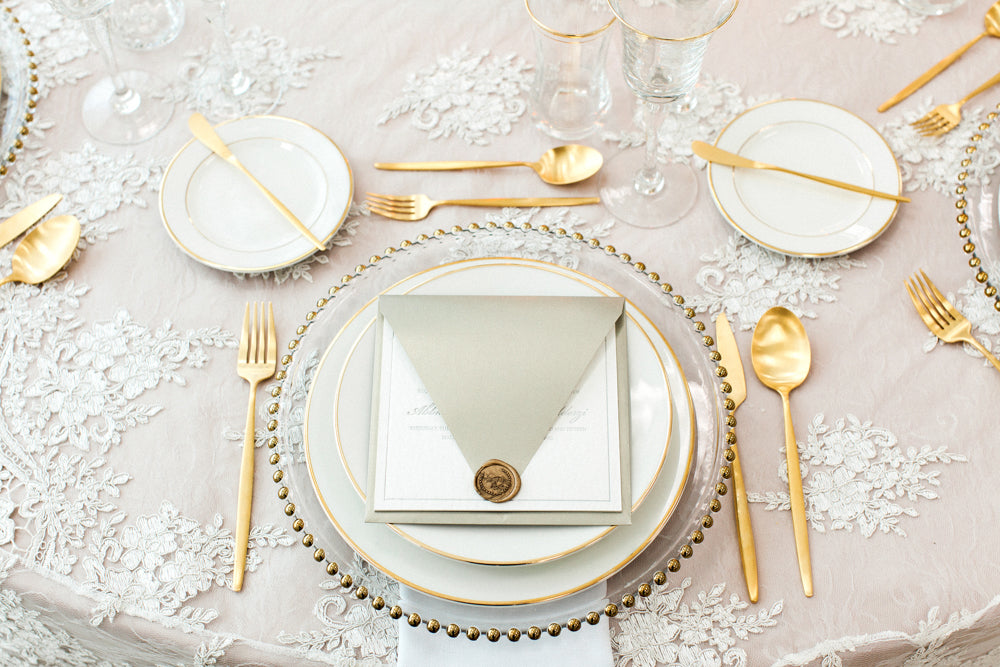 Elegant beaded charger plate in gold, featuring a textured beaded rim that adds a touch of opulence and sophistication to any table setting.